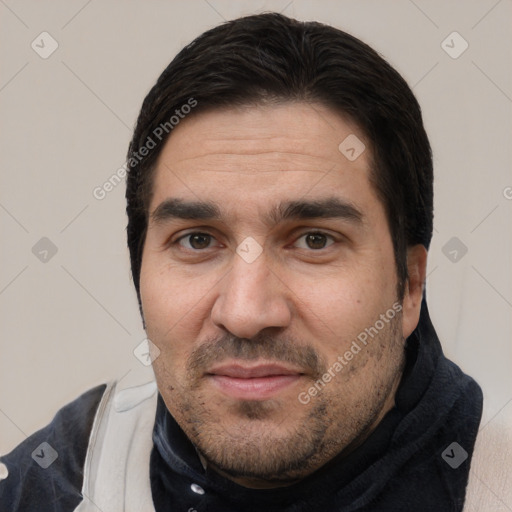 Joyful white adult male with short  black hair and brown eyes