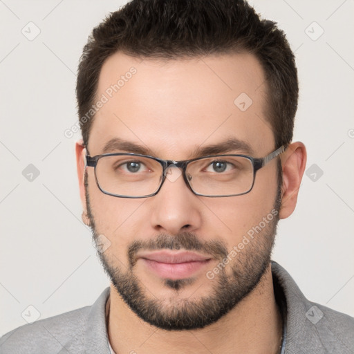 Neutral white young-adult male with short  brown hair and brown eyes