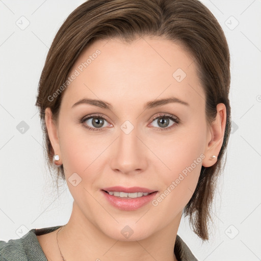 Joyful white young-adult female with medium  brown hair and blue eyes