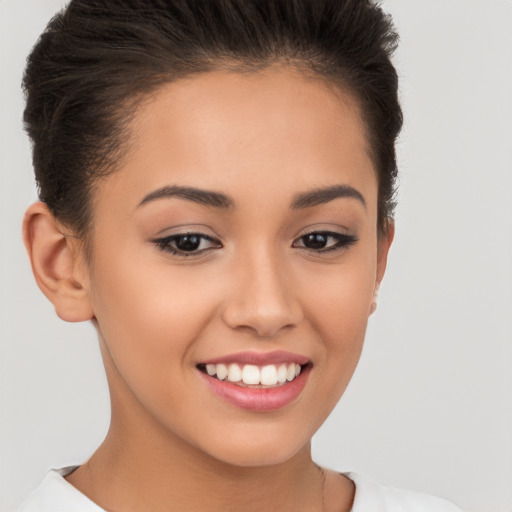 Joyful white young-adult female with short  brown hair and brown eyes