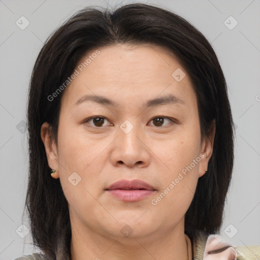 Joyful white adult female with medium  brown hair and brown eyes