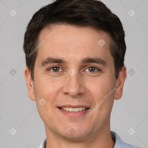 Joyful white adult male with short  brown hair and brown eyes