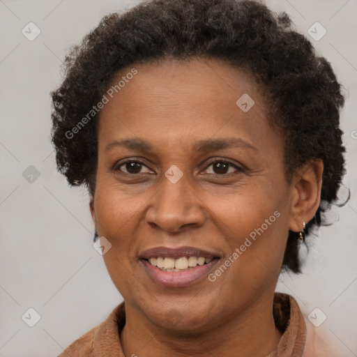 Joyful black adult female with short  brown hair and brown eyes