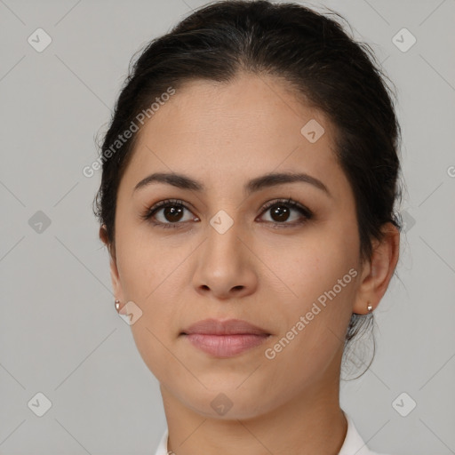 Joyful latino young-adult female with medium  brown hair and brown eyes