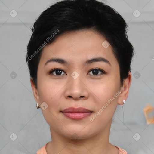 Joyful asian young-adult female with short  black hair and brown eyes