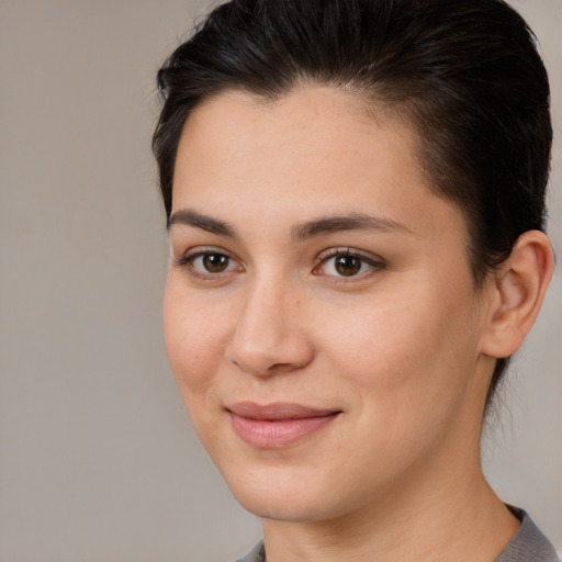 Joyful white young-adult female with medium  brown hair and brown eyes