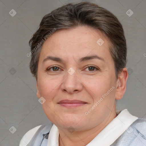Joyful white adult female with short  brown hair and brown eyes