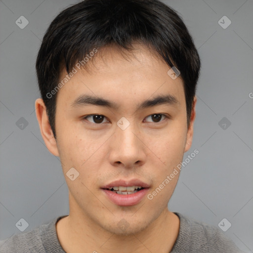 Neutral asian young-adult male with short  brown hair and brown eyes