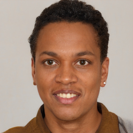 Joyful black young-adult male with short  brown hair and brown eyes