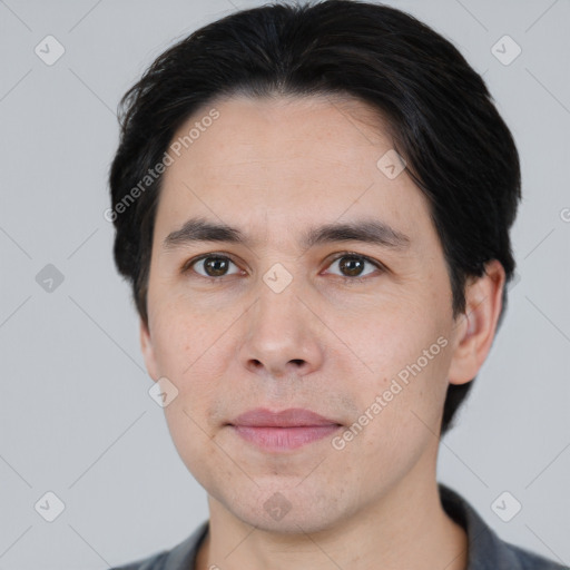 Joyful white young-adult male with short  black hair and brown eyes