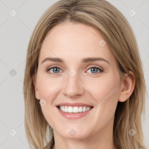 Joyful white young-adult female with long  brown hair and blue eyes