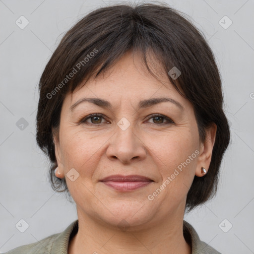 Joyful white adult female with medium  brown hair and brown eyes