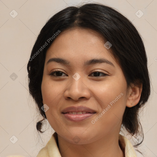 Joyful latino young-adult female with medium  brown hair and brown eyes