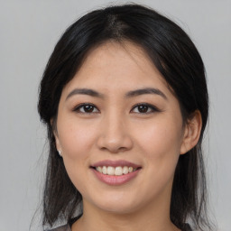 Joyful asian young-adult female with medium  black hair and brown eyes