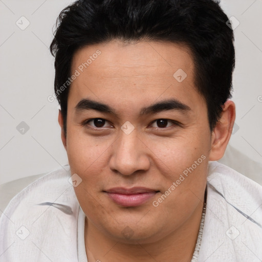 Joyful latino young-adult male with short  brown hair and brown eyes