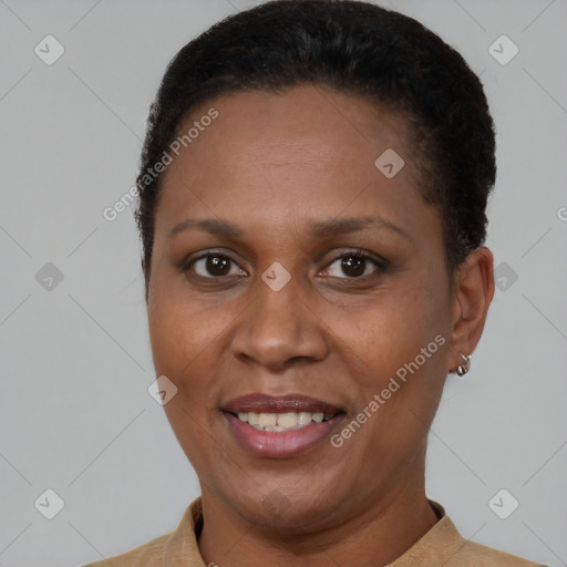 Joyful latino adult female with short  brown hair and brown eyes