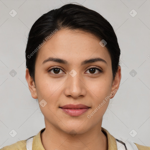 Joyful latino young-adult female with short  brown hair and brown eyes