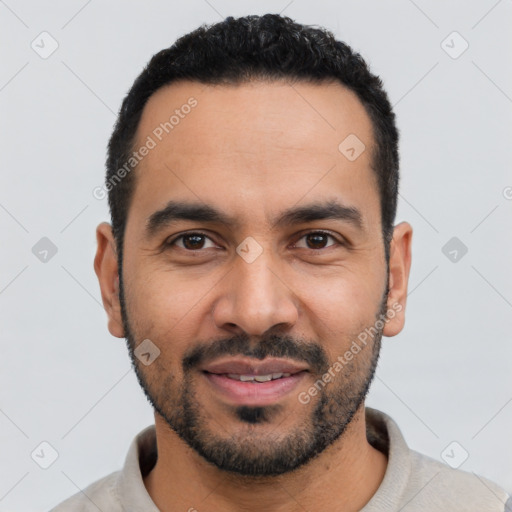 Joyful latino young-adult male with short  black hair and brown eyes