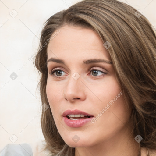 Joyful white young-adult female with medium  brown hair and green eyes