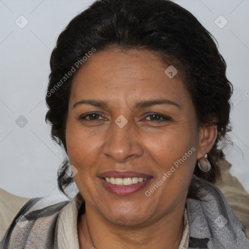 Joyful latino adult female with medium  brown hair and brown eyes