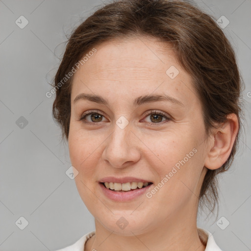 Joyful white young-adult female with medium  brown hair and grey eyes