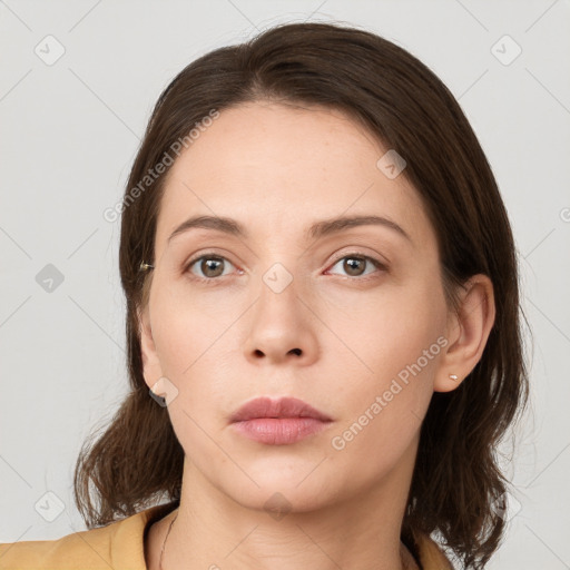 Neutral white young-adult female with medium  brown hair and grey eyes