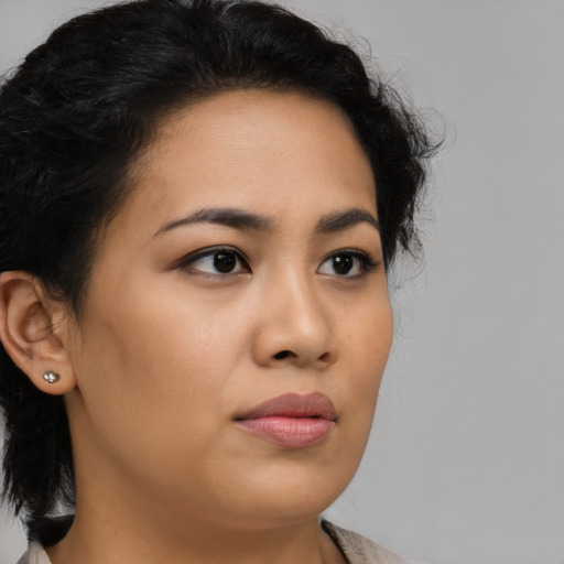 Neutral latino young-adult female with medium  brown hair and brown eyes