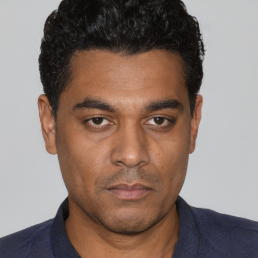 Neutral white young-adult male with short  black hair and brown eyes