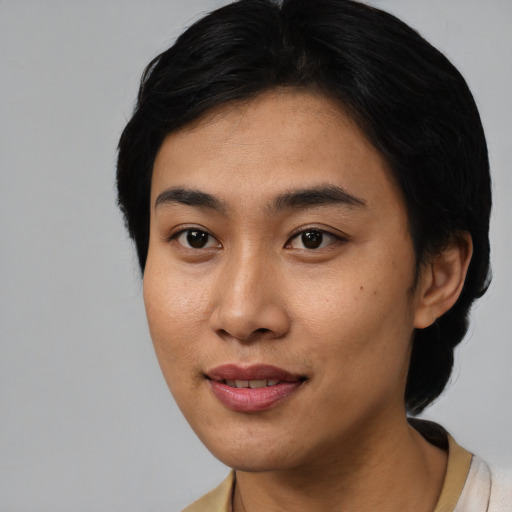 Joyful asian young-adult female with short  black hair and brown eyes