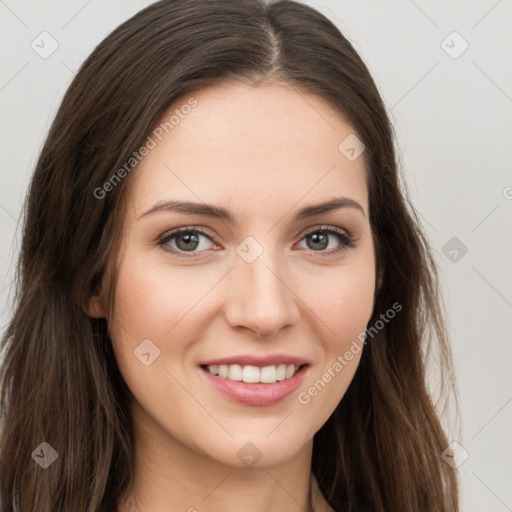 Joyful white young-adult female with long  brown hair and green eyes