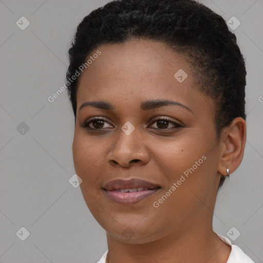 Joyful black young-adult female with short  black hair and brown eyes