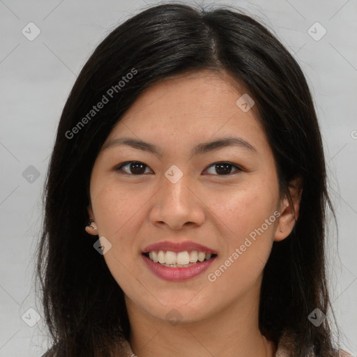 Joyful asian young-adult female with long  brown hair and brown eyes