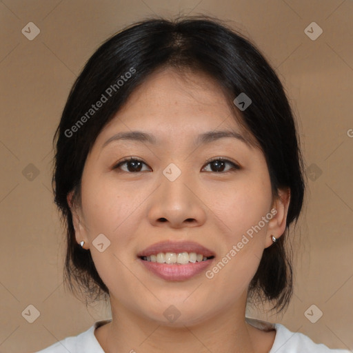 Joyful asian young-adult female with medium  brown hair and brown eyes