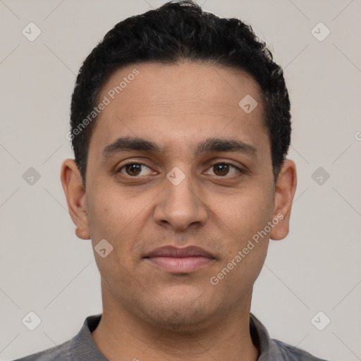 Neutral latino young-adult male with short  black hair and brown eyes