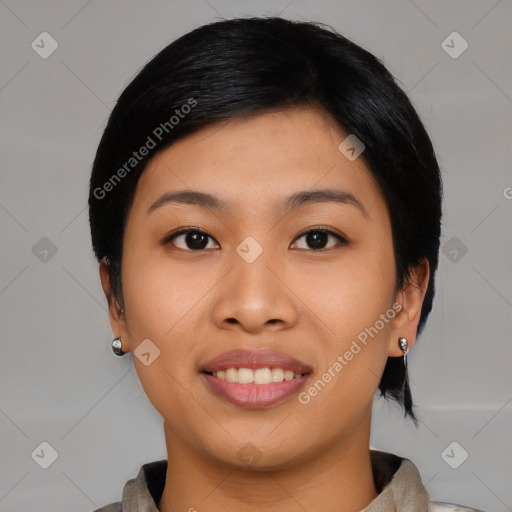 Joyful asian young-adult female with medium  black hair and brown eyes