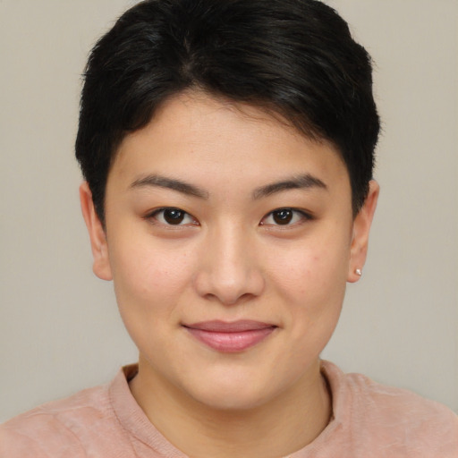 Joyful asian young-adult female with short  brown hair and brown eyes