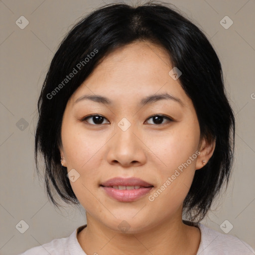 Joyful asian young-adult female with medium  black hair and brown eyes