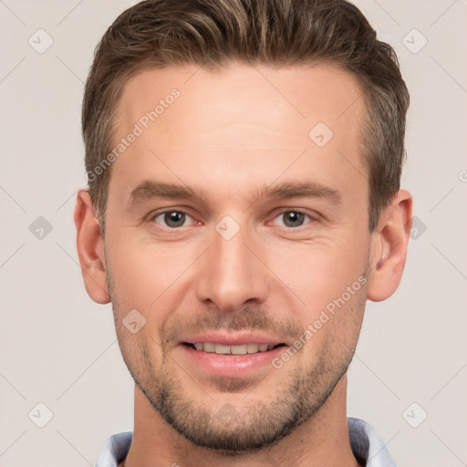 Joyful white young-adult male with short  brown hair and brown eyes