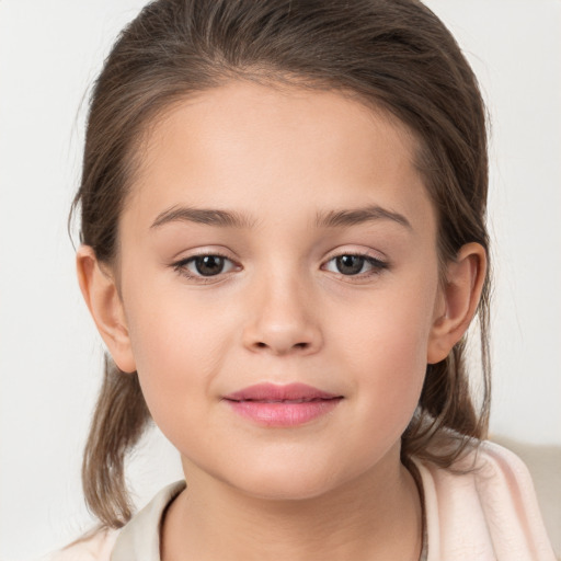 Joyful white child female with medium  brown hair and brown eyes