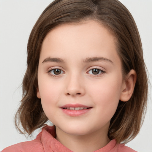 Joyful white child female with medium  brown hair and brown eyes