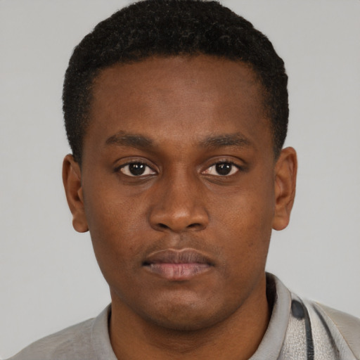 Neutral black young-adult male with short  brown hair and brown eyes