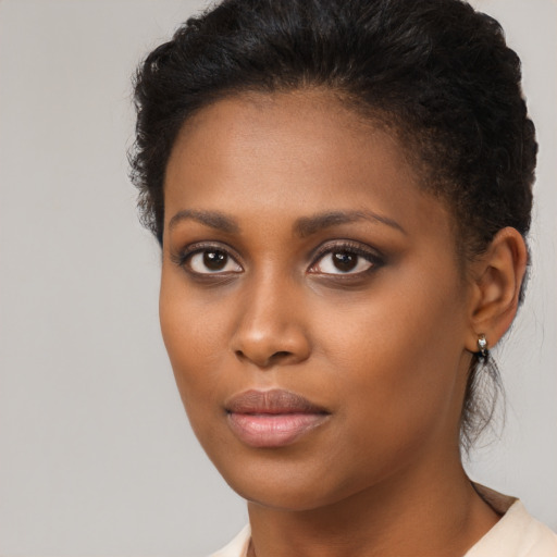 Neutral black young-adult female with short  brown hair and brown eyes