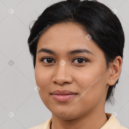 Joyful asian young-adult female with medium  black hair and brown eyes