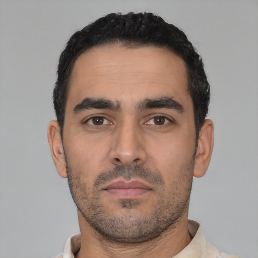Neutral latino young-adult male with short  black hair and brown eyes