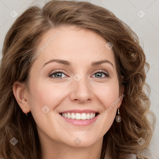 Joyful white young-adult female with long  brown hair and green eyes