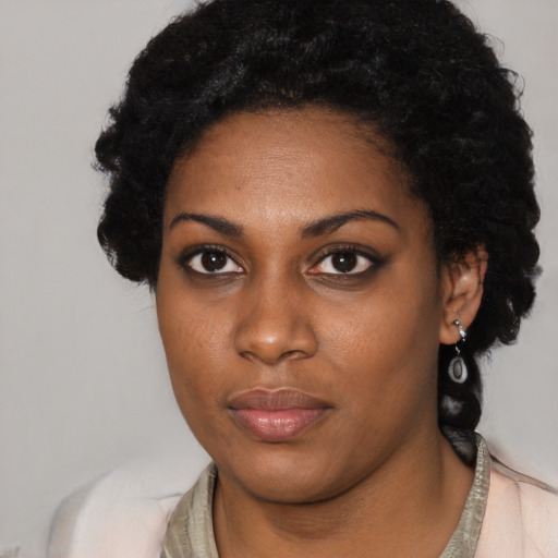 Neutral black young-adult female with short  black hair and brown eyes