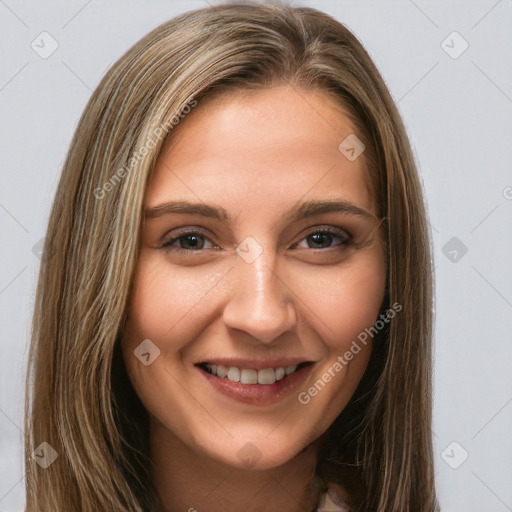 Joyful white young-adult female with long  brown hair and brown eyes