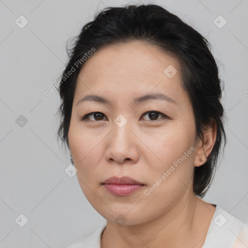 Neutral asian adult female with medium  brown hair and brown eyes