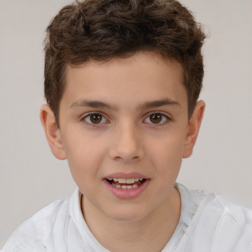 Joyful white child male with short  brown hair and brown eyes