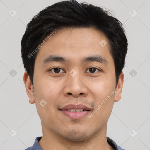 Joyful asian young-adult male with short  brown hair and brown eyes